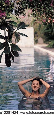Picture - woman, bikini, culture, one person, looking at camera, treatment, toothy smile. Fotosearch