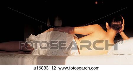 Stock Image - woman, therapeutic, beauty, one person, bed, quarter length. Fotosearch