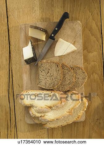 Bread and cheese on wooden board View Large Photo Image Stock Image - Bread and cheese on wooden board. Fotosearch