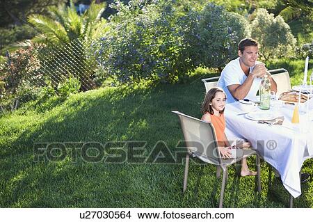 Family at an outdoor meal View Large Photo Image Picture - Family at an outdoor meal. Fotosearch