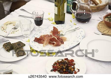 Stock Image - Food on table outdoors, close-up. Fotosearch