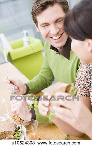 Man and woman eating health food View Large Photo Image Stock Photo - Man and woman eating health food. Fotosearch