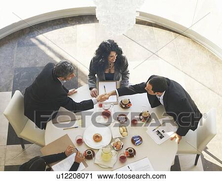 Two businessmen shaking hands in meeting View Large Photo Image Stock Image - Two businessmen shaking hands in meeting. Fotosearch