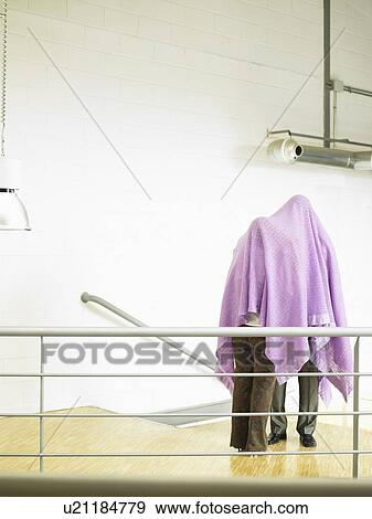 Businesspeople under a blanket View Large Photo Image Stock Photo - Businesspeople under a blanket. Fotosearch
