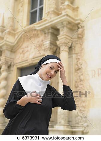 Nun smiling in front of ornate doorway, Alicante, Spain, View Large Photo Image Stock Image - Nun smiling in front of ornate doorway, Alicante, Spain,. Fotosearch