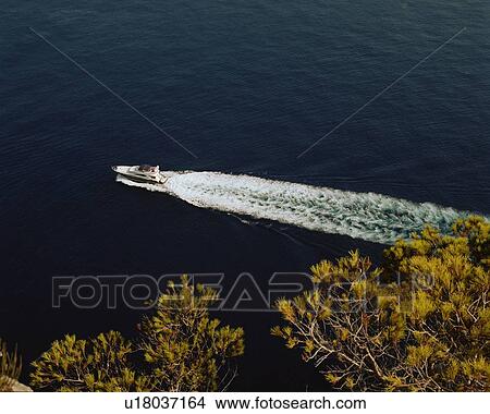 A speedboat in the water. View Large Photo Image Picture - A speedboat in the water.. Fotosearch