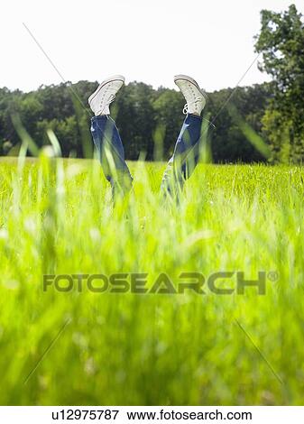 Legs of a woman pointing towards the sky. View Large Photo Image Stock Photo - Legs of a woman pointing towards the sky.. Fotosearch