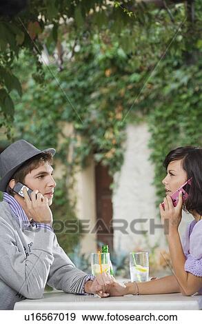 Stock Photo - Man and woman holding hands.. Fotosearch