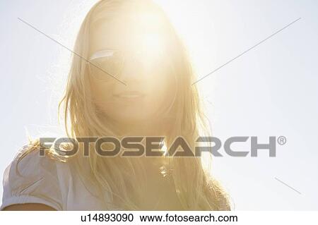Stock Image - Portrait of young woman.. Fotosearch