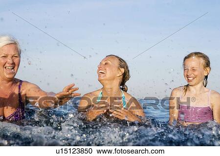 Stock Image - 3 generations bathing. Fotosearch