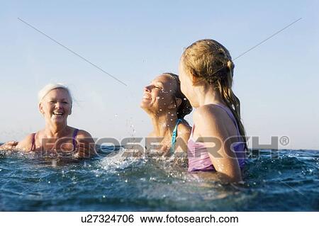 Stock Photograph - 3 generations bathing. Fotosearch