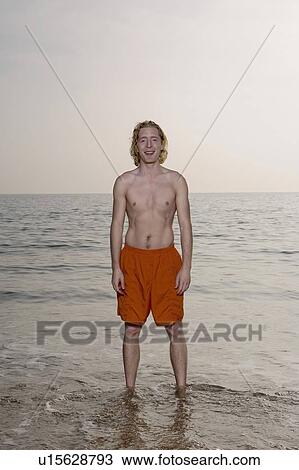 Stock Image - Man wearing a swimming costume.. Fotosearch