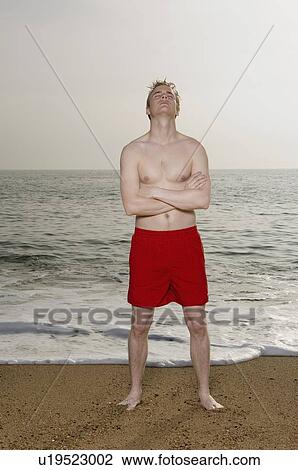 Man wearing a swimming costume. View Large Photo Image Stock Image - Man wearing a swimming costume.. Fotosearch