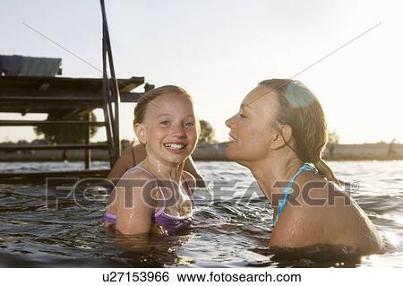 Mother and daughter laughing View Large Photo Image Stock Photograph - Mother and daughter laughing. Fotosearch