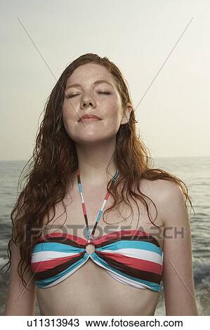Stock Image - Portrait of young woman.. Fotosearch