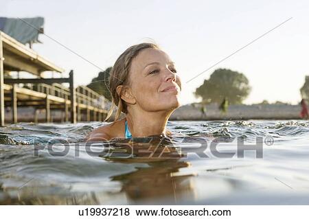 Stock Photo - Woman swimming. Fotosearch
