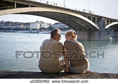 Couple by riverside View Large Photo Image Stock Image - Couple by riverside. Fotosearch