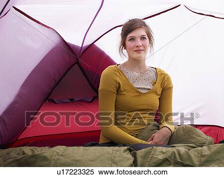 Girl sitting in sleeping bag in pink tent View Large Photo Image Stock Photography - Girl sitting in sleeping bag in pink tent. Fotosearch
