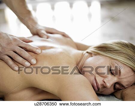 Woman having massage View Large Photo Image Stock Image - Woman having massage. Fotosearch