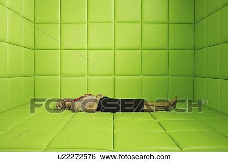 Woman resting in green padded cell View Large Photo Image Stock Photograph - Woman resting in green padded cell. Fotosearch