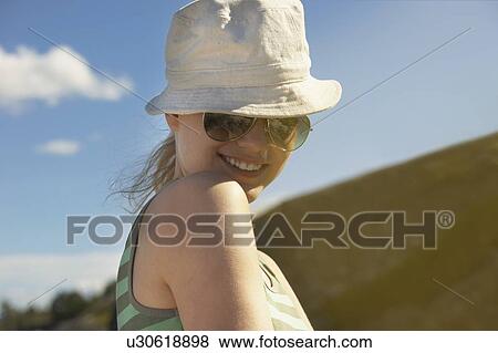 Young woman wearing sun hat. View Large Photo Image Stock Photo - Young woman wearing sun hat.. Fotosearch