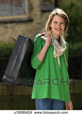 Girl with shopping bag View Large Photo Image Picture - Girl with shopping bag. Fotosearch