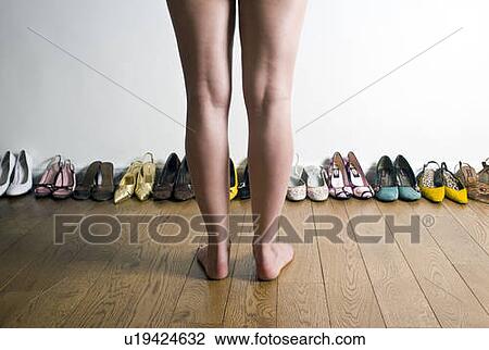 Legs in front of row of shoes View Large Photo Image Stock Image - Legs in front of row of shoes. Fotosearch