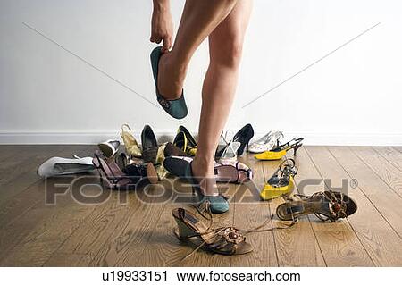 Legs surrounded by shoes View Large Photo Image Stock Image - Legs surrounded by shoes. Fotosearch