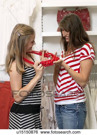 Mother and daughter shopping View Large Photo Image Stock Photograph - Mother and daughter shopping. Fotosearch