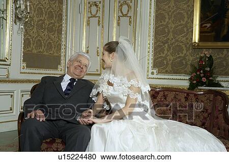 Stock Image - Bride with Father, smiling. Fotosearch