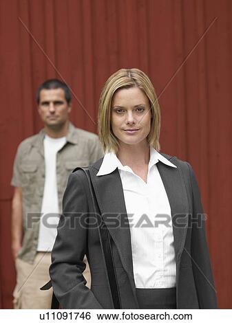 Businesswoman and man by country cottage View Large Photo Image Stock Photograph - Businesswoman and man by country cottage. Fotosearch