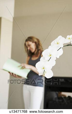 Defocused woman looks at file View Large Photo Image Stock Photo - Defocused woman looks at file. Fotosearch