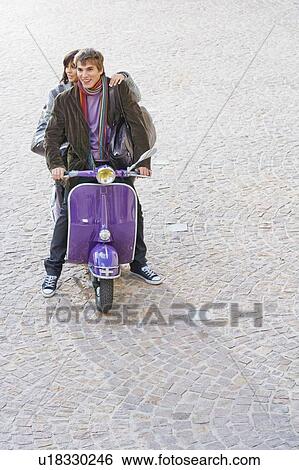 Man and woman on scooter. View Large Photo Image Stock Photograph - Man and woman on scooter.. Fotosearch