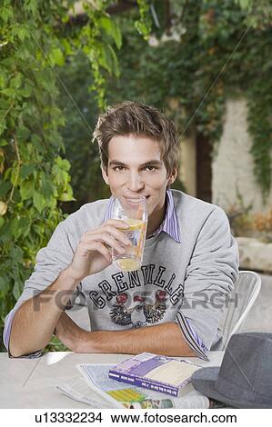 Picture - Man drinking soft beverage.. Fotosearch