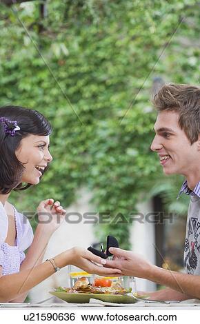 Stock Photograph - Man proposing to woman.. Fotosearch