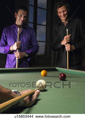 Picture - Men playing snooker. Fotosearch