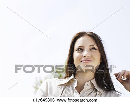 Woman standing outdoors View Large Photo Image Stock Image - Woman standing outdoors . Fotosearch