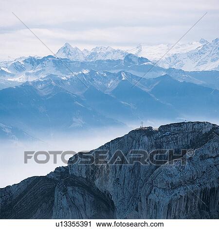 Mountain Range, Winter, Polar Landscape, Fog, Generic Location, Non-Urban Scene, Snow View Large Photo Image Stock Image - Mountain Range, Winter, Polar Landscape, Fog, Generic Location, Non-Urban Scene, Snow. Fotosearch