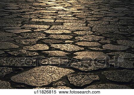 a Cobbled Road, Some Light Partly Shining at It, High Angle View, Lisbon, Portugal, Europe View Large Photo Image Stock Photography - a Cobbled Road, Some Light Partly Shining at It, High Angle View, Lisbon, Portugal, Europe. Fotosearch