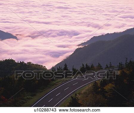a Country Road, Next to a Mountainchain Covered With Clouds, High Angle View View Large Photo Image Stock Image - a Country Road, Next to a Mountainchain Covered With Clouds, High Angle View. Fotosearch