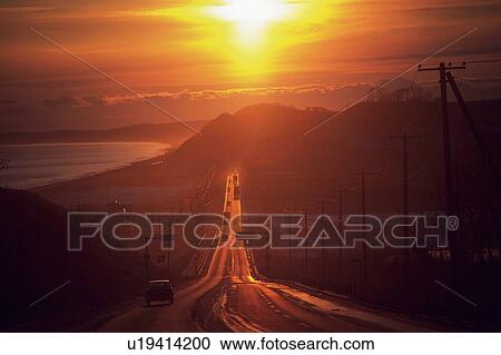 a Country Road, Surrounded By Mountains, By Sunset, High Angle View View Large Photo Image Stock Image - a Country Road, Surrounded By Mountains, By Sunset, High Angle View. Fotosearch