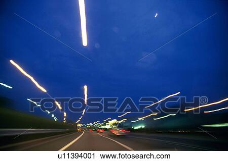 a Highway With Several Cars, Surrounded By Lights, Blurred Motion, Long Exposure View Large Photo Image Stock Image - a Highway With Several Cars, Surrounded By Lights, Blurred Motion, Long Exposure. Fotosearch
