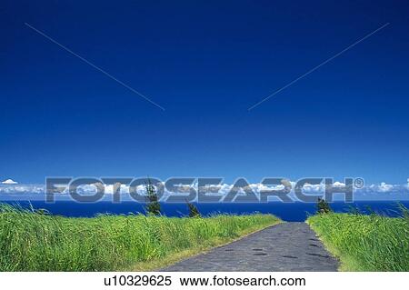Stock Photography -  a Little Path Through a Grassfield With the Ocean in the Background. Fotosearch