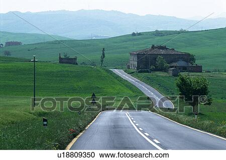 a Long Country Road Taking Course in a Huge Flat Green Land With Mountains an the Horizon, High Angle View View Large Photo Image Stock Image - a Long Country Road Taking Course in a Huge Flat Green Land With Mountains an the Horizon, High Angle View. Fotosearch