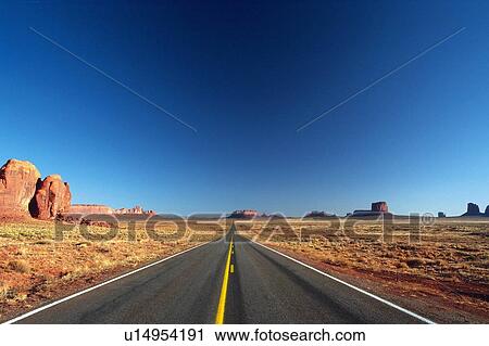 a Road at Monument Valley Under a Deep Blue Sky, Front View, Arizona, USA View Large Photo Image Stock Image - a Road at Monument Valley Under a Deep Blue Sky, Front View, Arizona, USA. Fotosearch