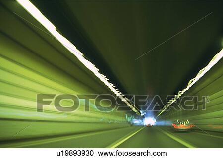 Stock Image -  a Tunnel With Several Cars and Lights in It, Front View, Long Exposure, Blurred Motion. Fotosearch