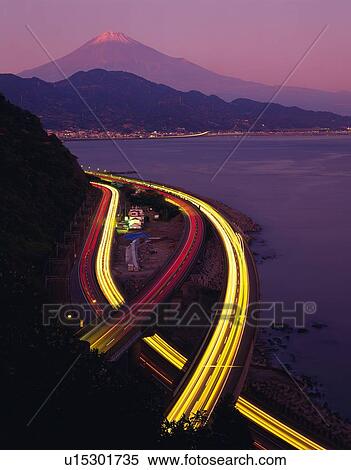 Stock Photography -  the Mt. Fuji With a Highway in Foreground, High Angle View, Long Exposure, Shizuoka Prefecture, Japan. Fotosearch