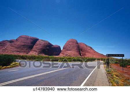 the Mt. Olga (Kata Tjyta) In Front of a Country Road and Under a Blue Sky, Australia, Oceania View Large Photo Image Stock Image - the Mt. Olga (Kata Tjyta) In Front of a Country Road and Under a Blue Sky, Australia, Oceania. Fotosearch