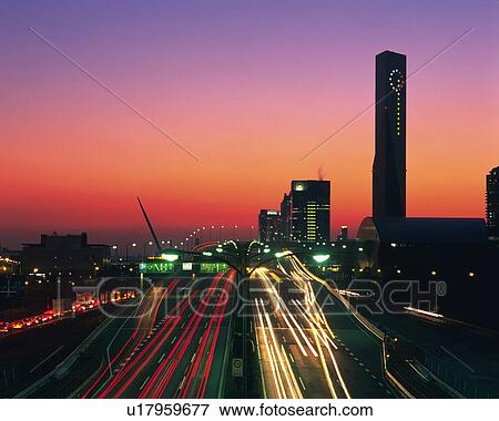 Stock Photo -  the Wangan Highway by Sunset, Front View, Long Exposure, Tokyo Prefecture, Japan. Fotosearch
