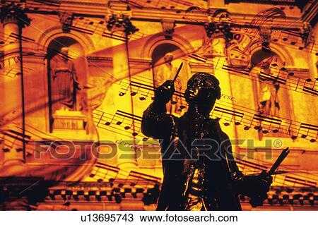 Stock Image - Bronze statue and score. Fotosearch